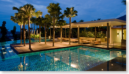 Evening Scene of Luxury Home Lanai with surrounding pool